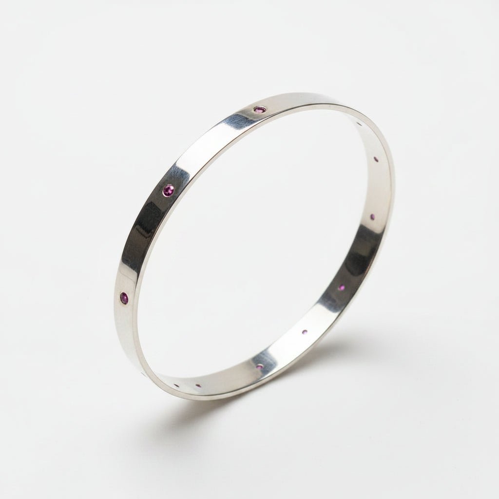 Handmade Sterling Silver Lab Grown Pink Sapphire Flush Set bangle. Australian made.